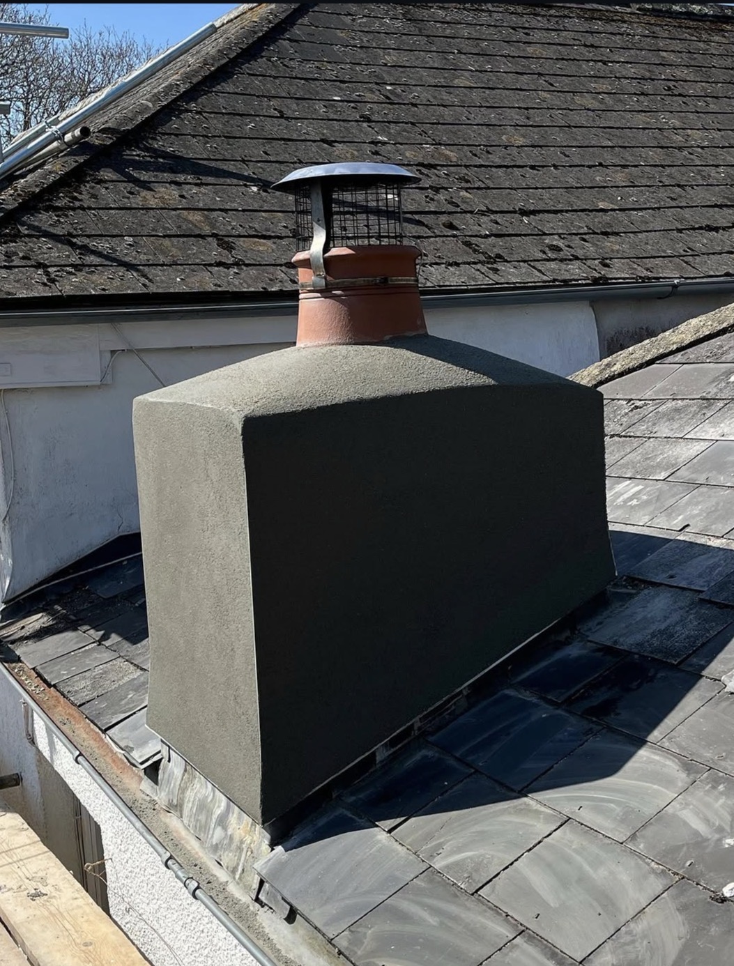 Rebuilt chimney stack with fresh render, new flaunching, pot and cowl